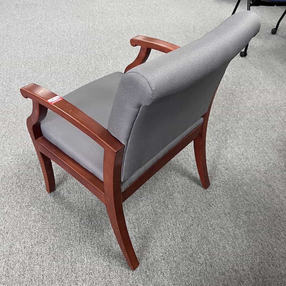 grey upholstered guest chair with cherry veneer arms and legs