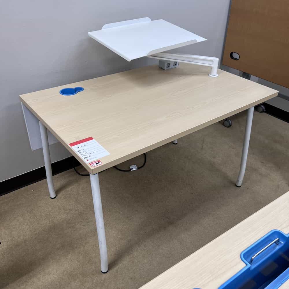 maple laminate with blue plastic inserts for files and cups, white legs, white tray on a monitor arm