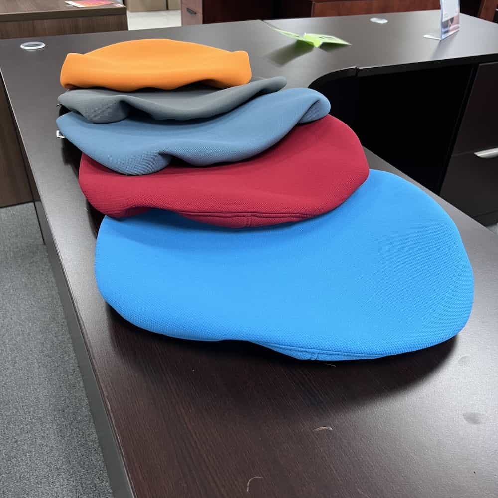seat covers in blue, red, grey, and orange. For office chairs