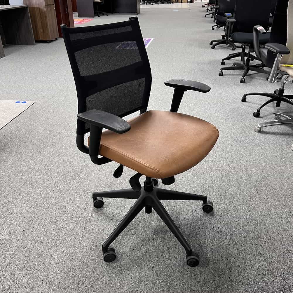sitonit wit chair with black mesh back and tan vinyl seat