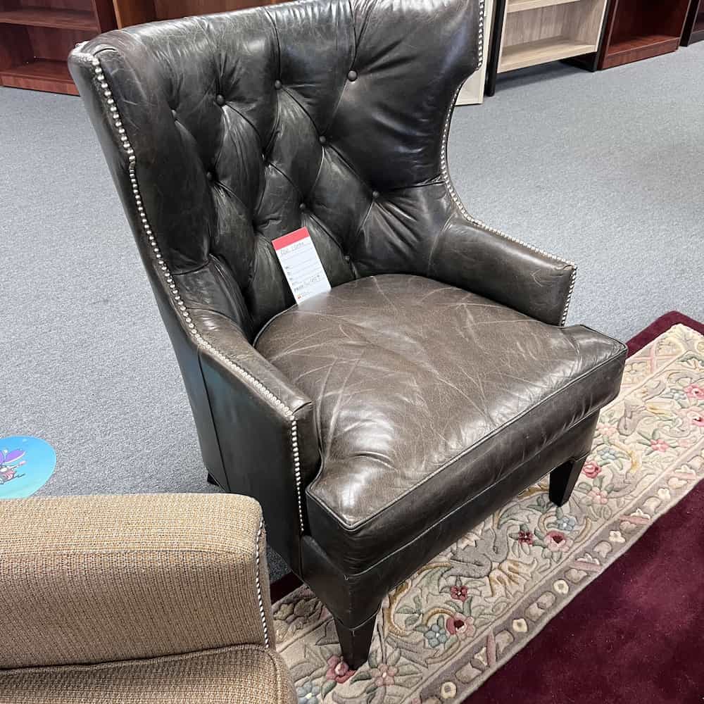brown leather studded wing back arm chair