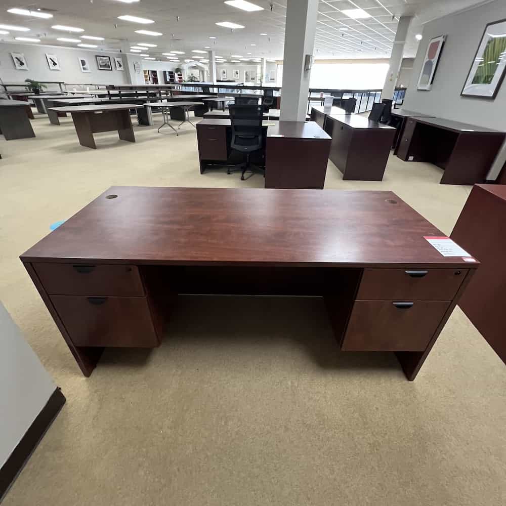 cherry laminate desk with black pulls and two hanging box files
