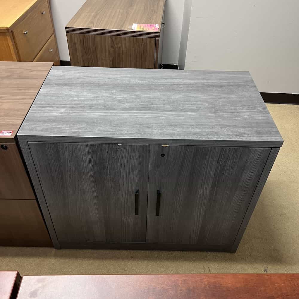 grey laminate 2 door storage cabinet with black pulls