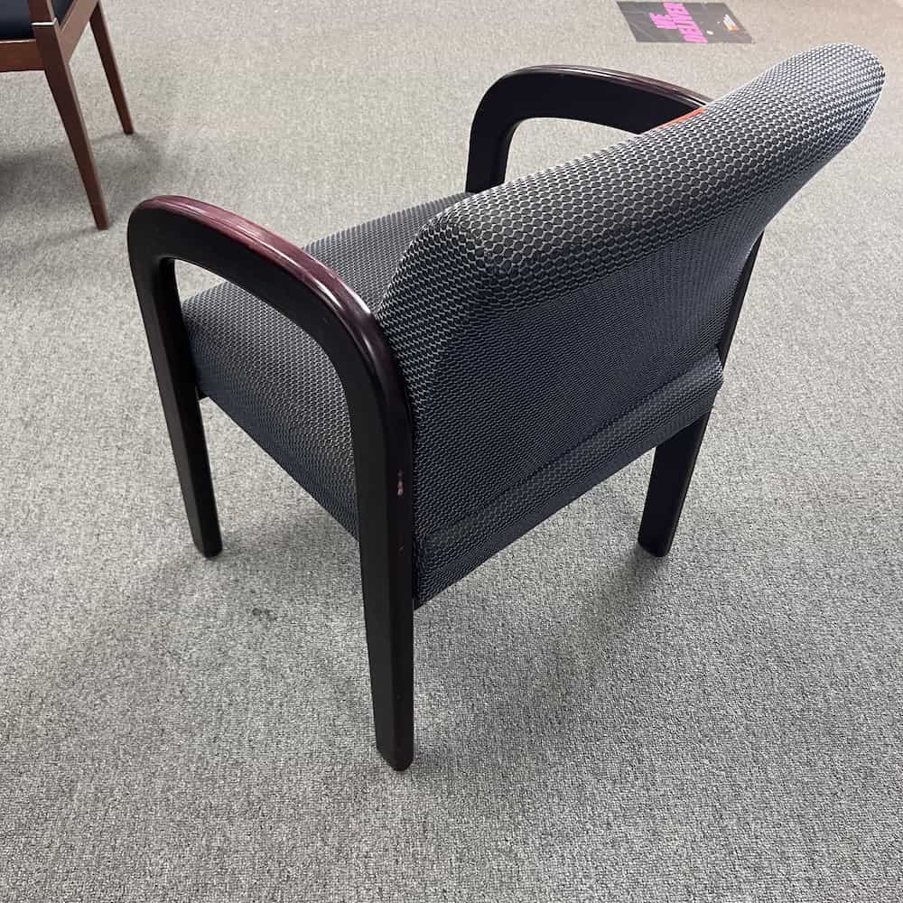 grey and black circles upholstery with mahogany veneer arms and legs guest chair