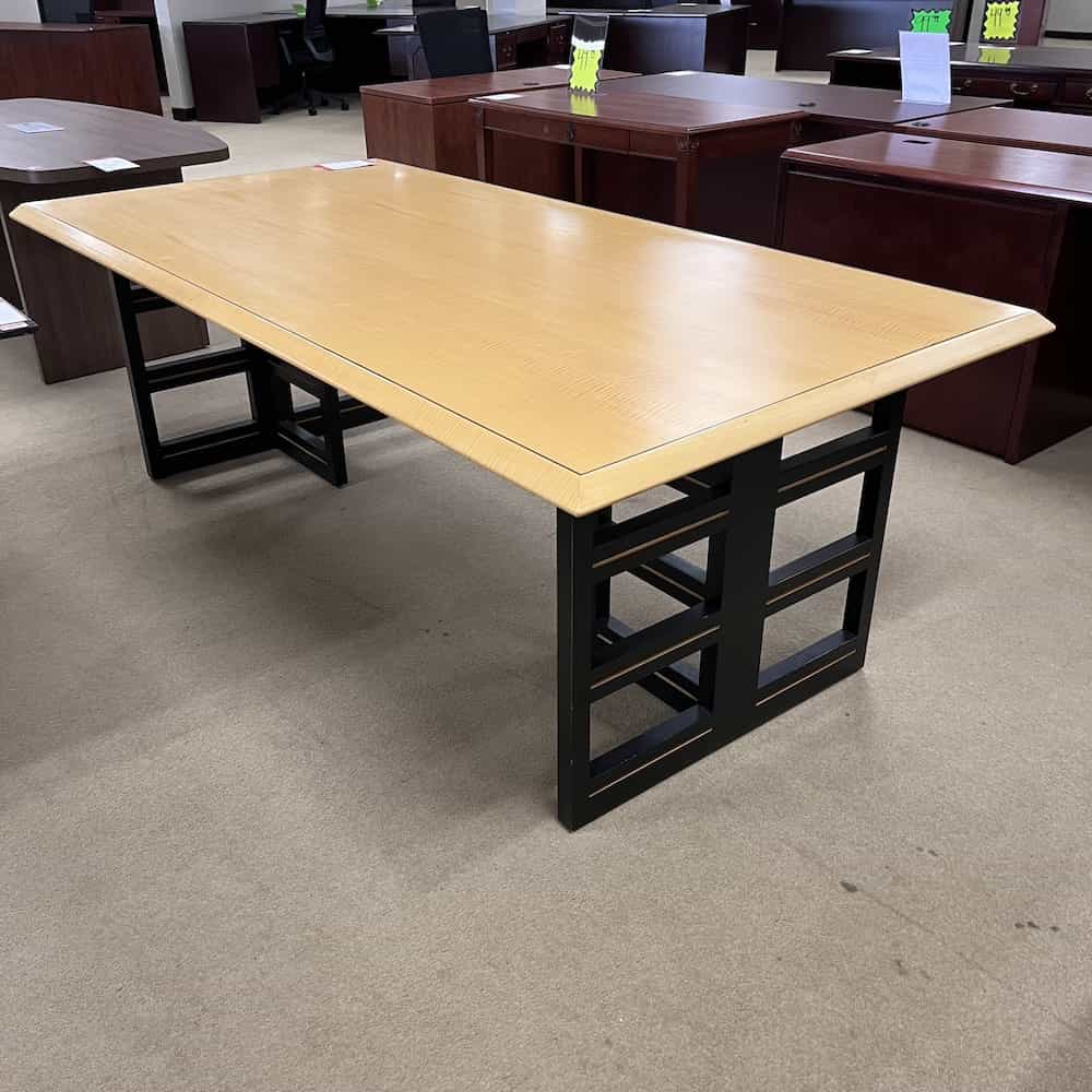 rectangl 7 ft conference table with maple veneer top and black base with vertical squares