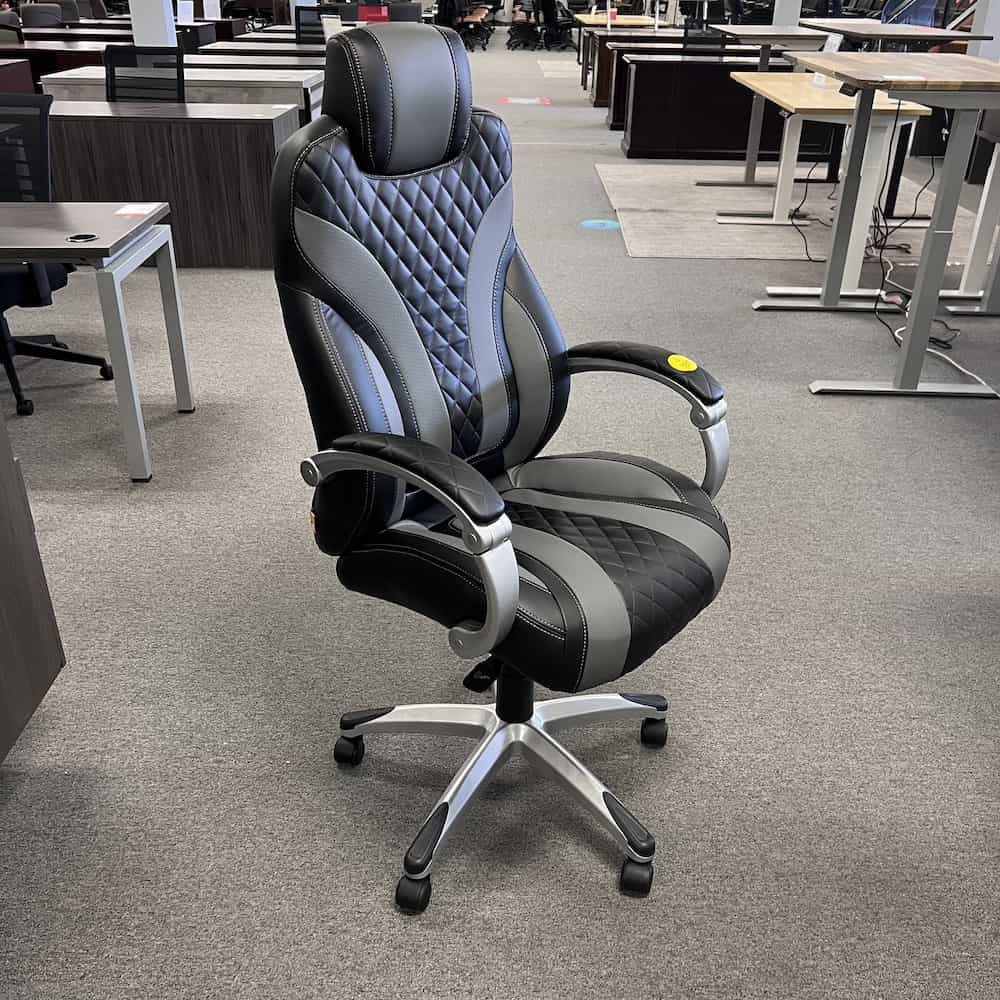 black and grey vinyl executive chair with white stitching and diamond details