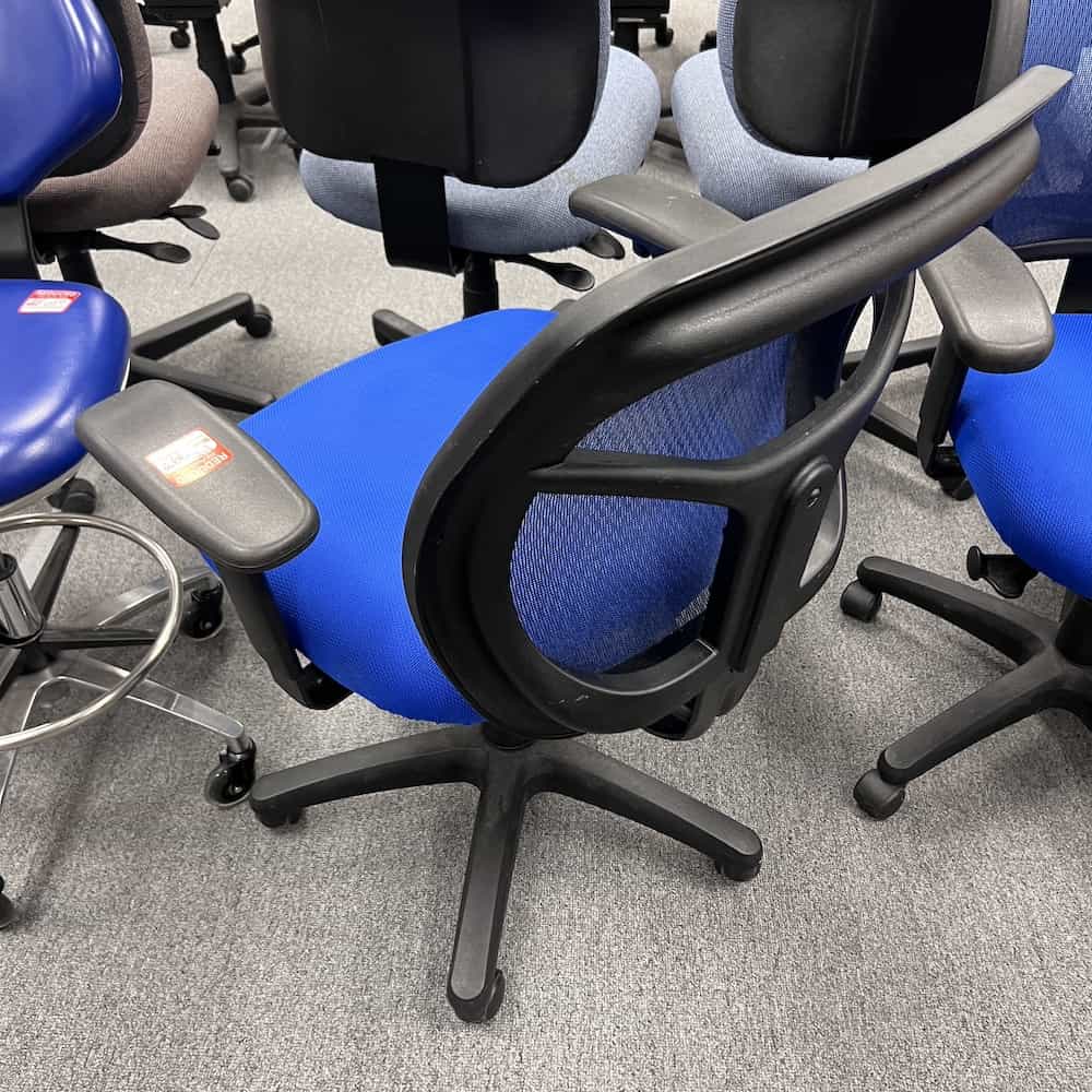 bright blue upholstered seat cushion with blue mesh back, black arms and structure. office task chair