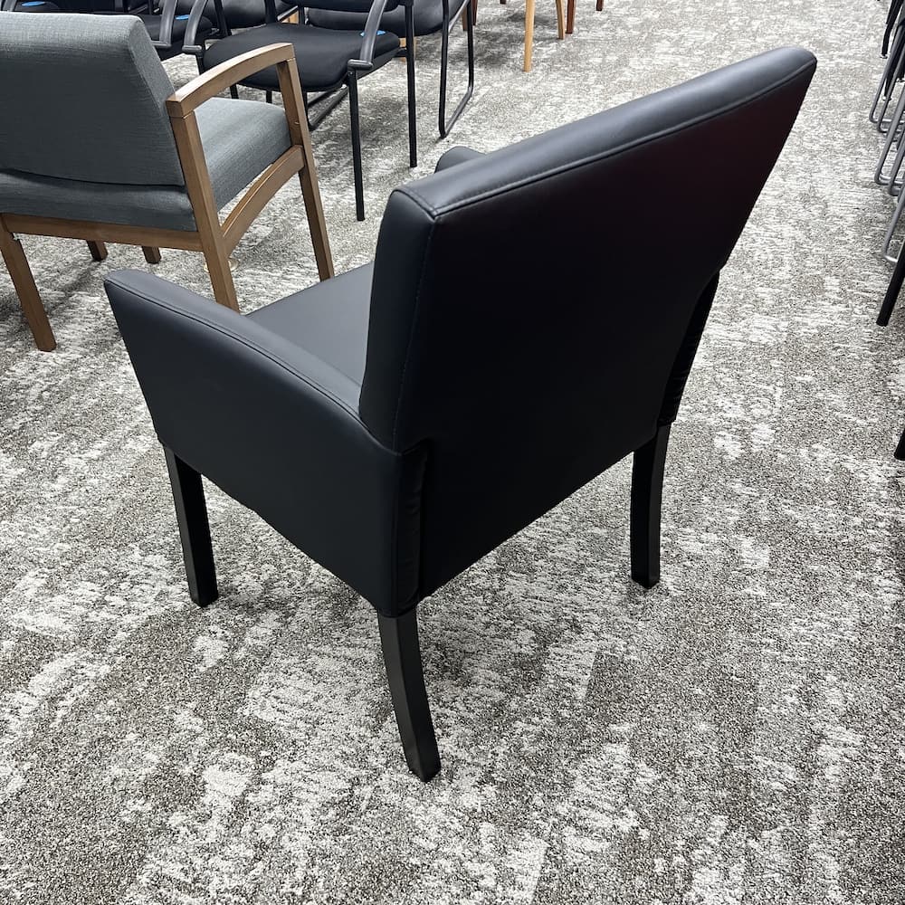 black vinyl guest arm chair