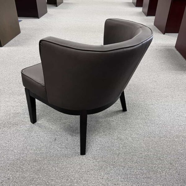 brown vinyl cocktail chair with mid back and black legs