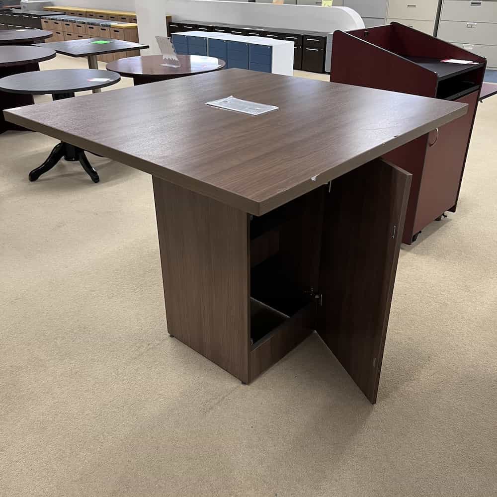 walnut laminate square bar height table with cabinet in the base
