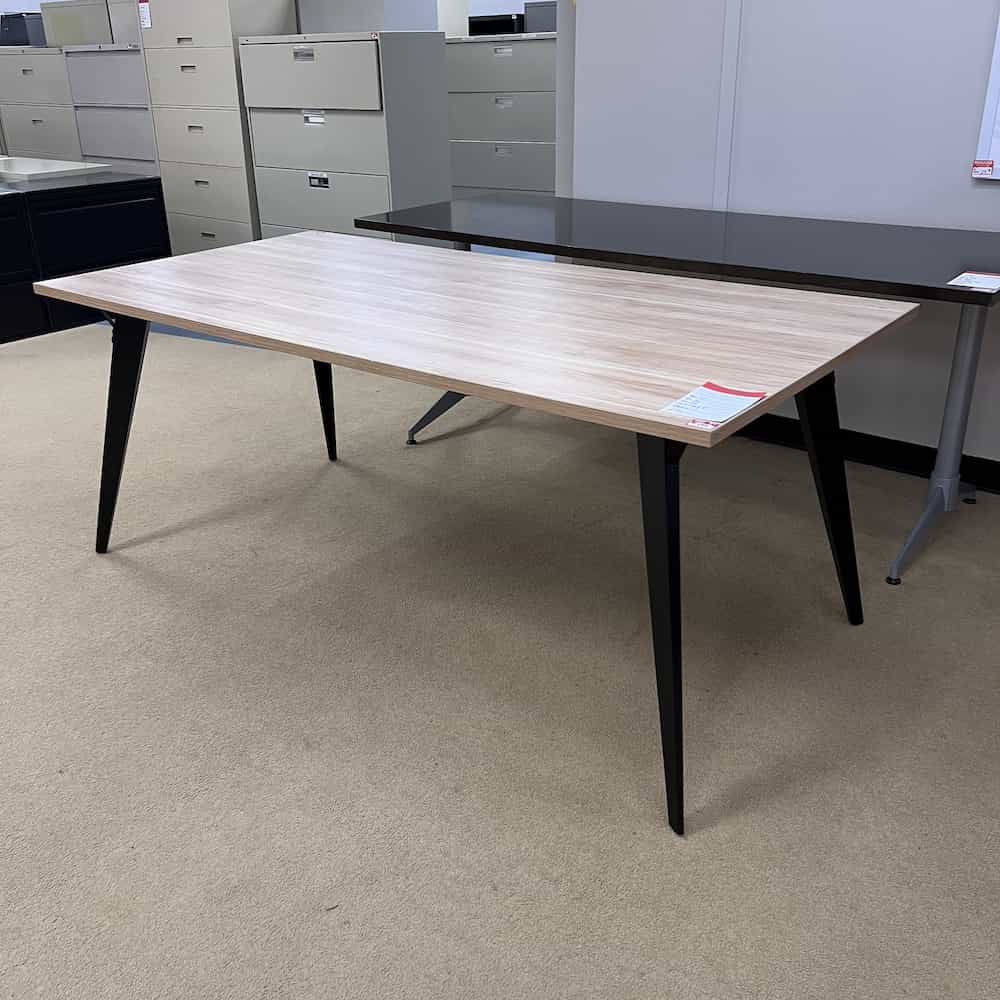 butcher block maple top with black oblique legs