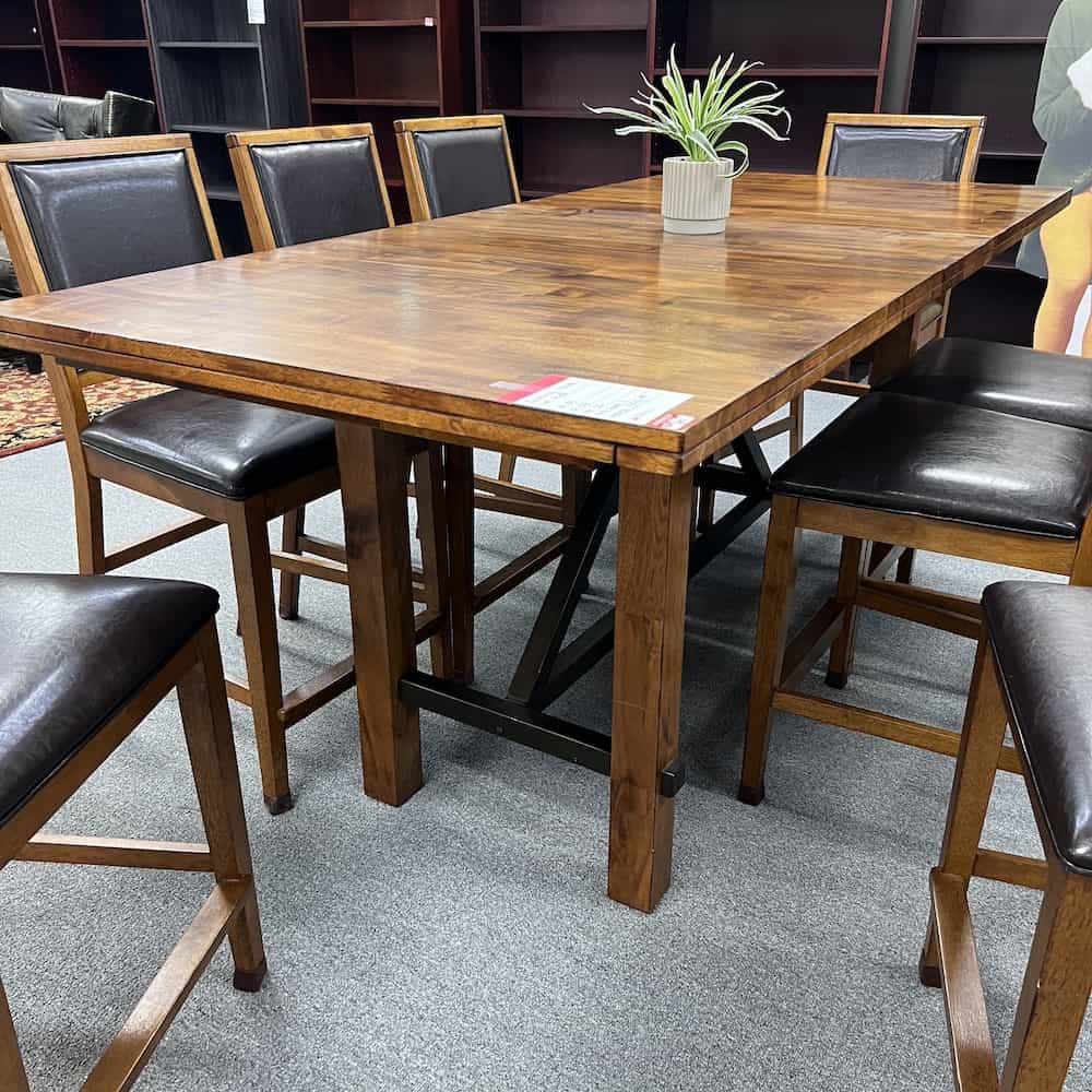 walnut rectangle counter height dining table with leaf and 8 chairs and brown vinyl seats and backs, used