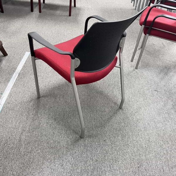 perforated back sitwell red burgundy upholstered seat, black plastic back, silver legs guest stacking chair with arms