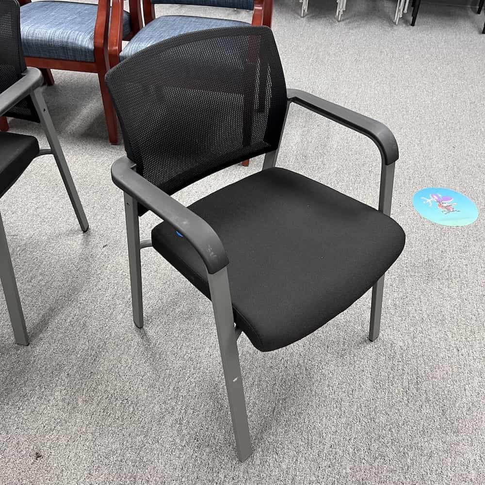 Mesh Back Guest Chair, black seat with arms lorell brand used