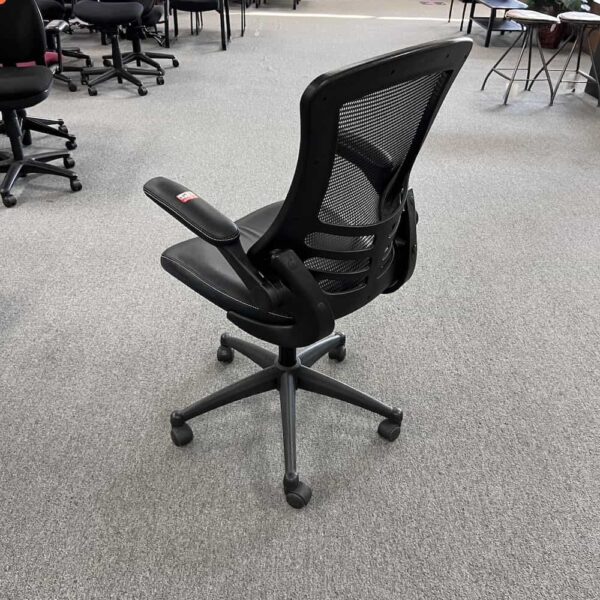 cutie black mesh back office task chair flip back chair used white stitching