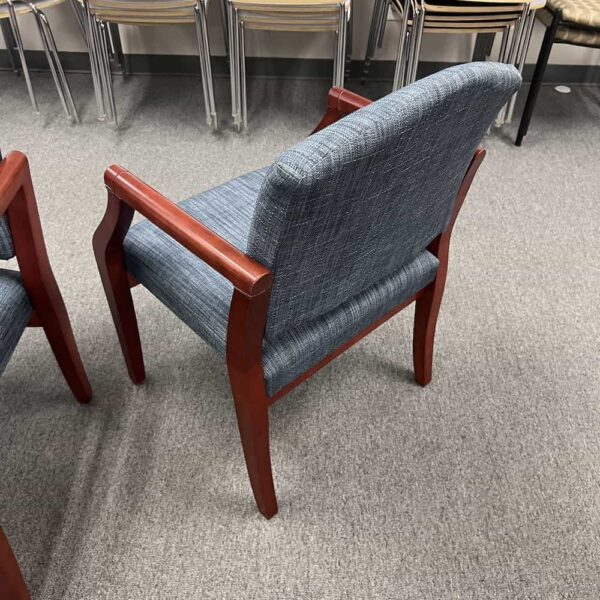 blue upholstered guest chair with cherry veneer arms