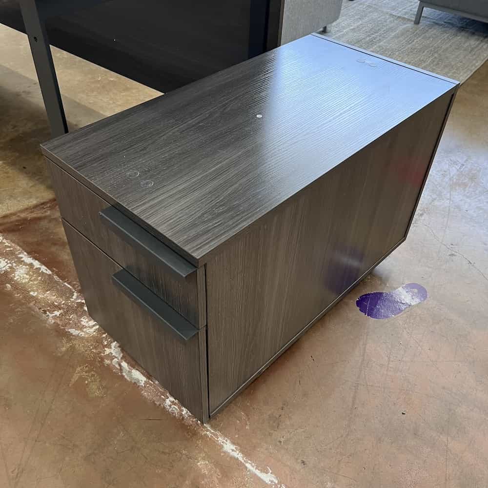 Bow Front Desk Drawers: 1 box box file Dimensions: 71" W x 42" D x 29" H Color/Finish: coastal grey laminate Consignment Code: E Used Condition Rating: 9 Please use our webtext platform to inquire about availability and to order. We hold with payment for three days. ITEM CONDITION RATING SCALE 10: Like New! Often an unused, discontinued item. 9: Open box. Never used but may have a flaw. 8: Good! Great! 7: Light scratches and dings. 6: Okay, has more than a few flaws. 5: Seriously scratched and dented… in-store only please. 4 or less: Badger bite deal. Not on website. Might be a free front porch item, recycled, etc. THIS ITEM DOES NOT SHIP Pick up in San Antonio or delivery in Texas only. If you need delivery, we offer this service for an additional fee. For delivery estimates, please message us through our web text platform.
We will get back to you as soon as we can!