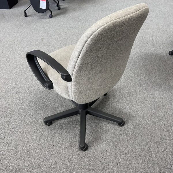 beige upholstery and black base and arms conference chair global used
