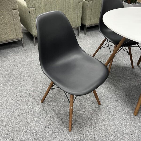 black molded plastic cafeteria chair with walnut legs