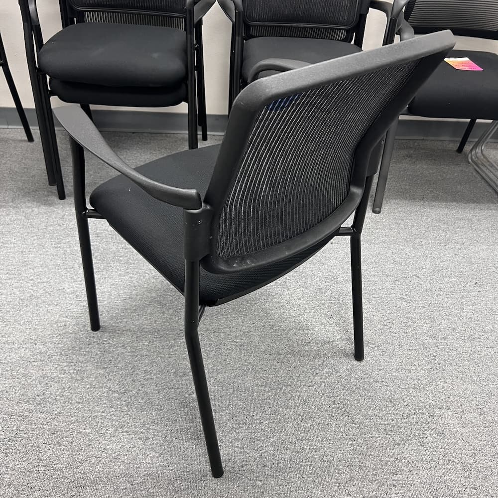 black mesh back stacking chair with upholstery seat stacking office furniture guest lounge area