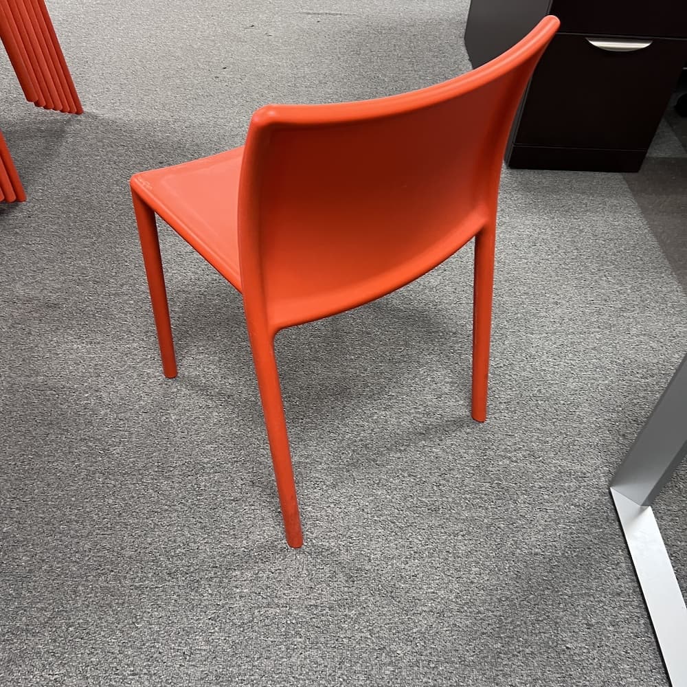 orange plastic indoor outdoor stacking chair magis air used furniture