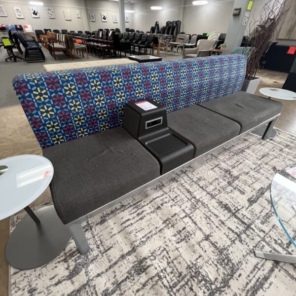 bench steelcase healthcare systems blue, red, yellow star flower pattern upholstery base and grey seat, power plug center, used office furniture