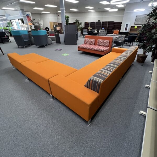orange upholstered l-shaped sofa couch sectional with brown striped cushion backs nienkamper brand used furniture office lounge waiting room conversation pit