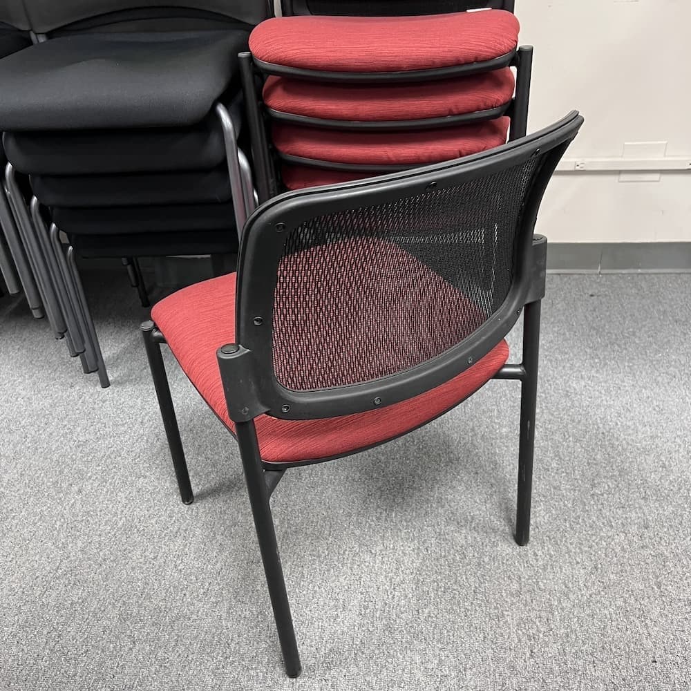 burgundy red upholstered seat, black mesh back stacking chair, used office furniture