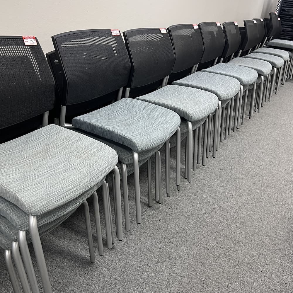 grey upholstered seat, black mesh back stacking chair sitonit focus used office furniture