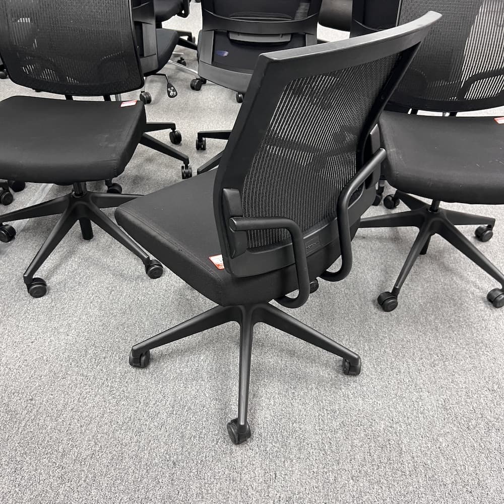 black upholstered seat with mesh back task chair, armless, used office furniture, sitonit focus