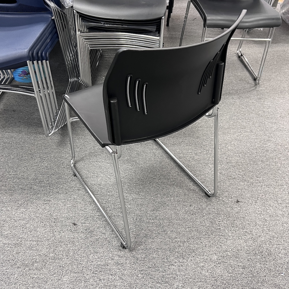black plastic stacking chair with chrome legs, rise chair, office furniture