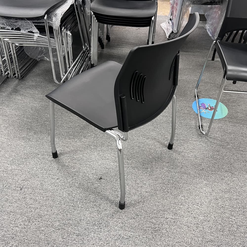 black plastic stacking chair with chrome legs, used office furniture