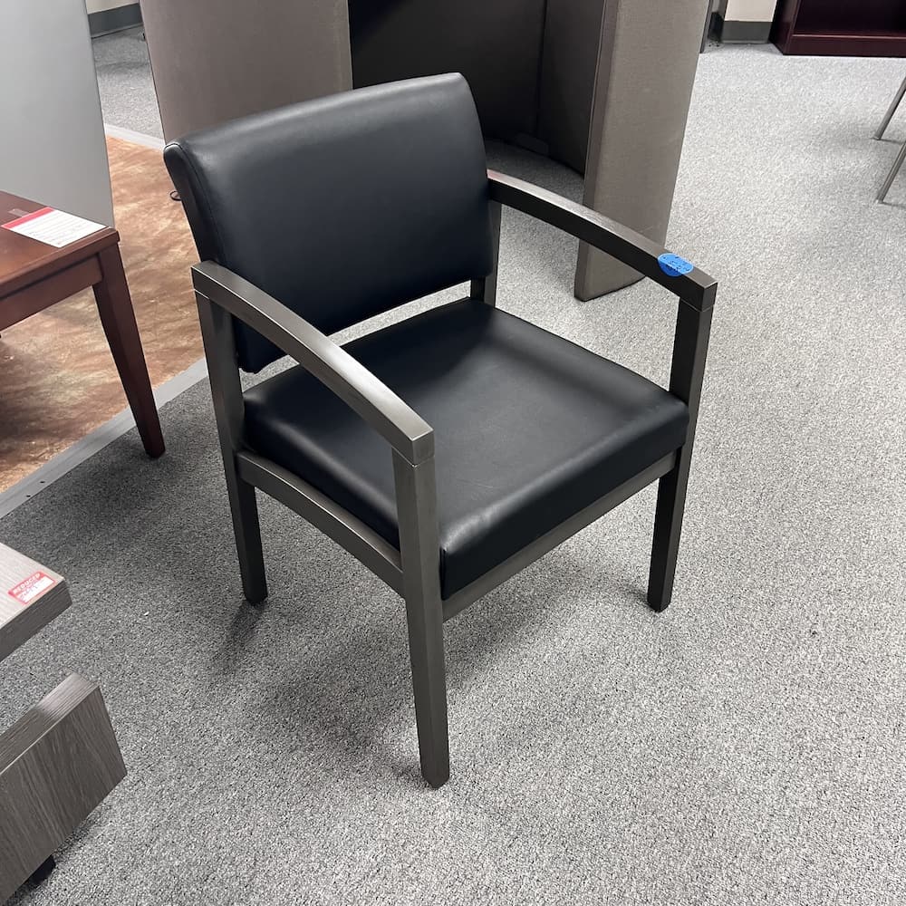 black vinyl guest chair with grey veneer arms and legs