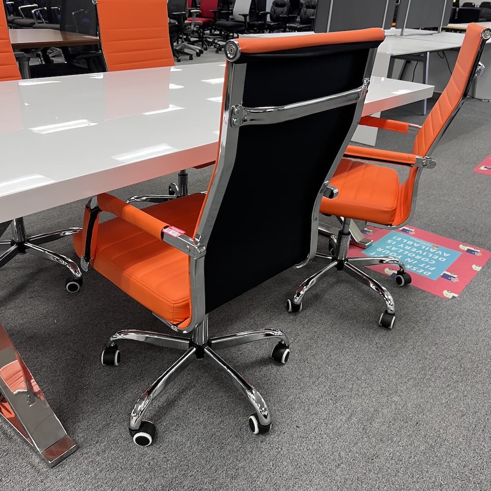 Orange conference chair with chrome base and frame, black back. used conference furniture, modern