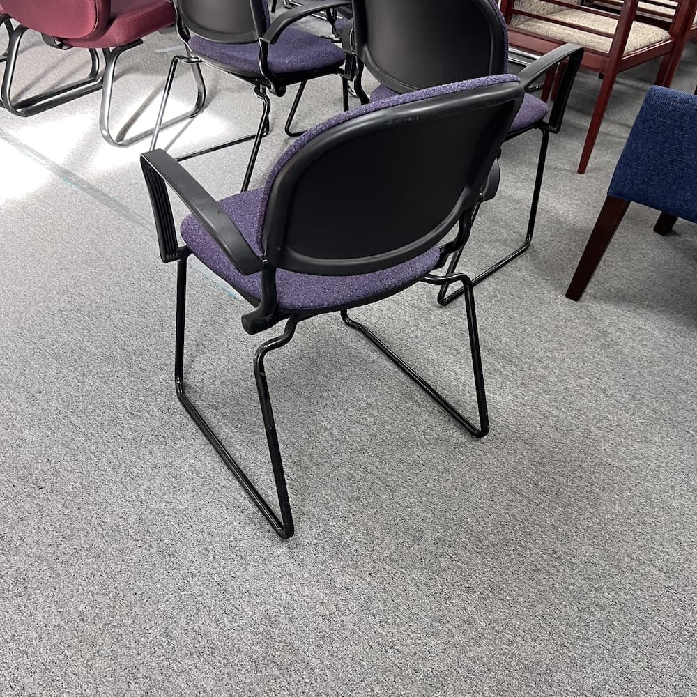 purple upholstered guest chair with black frame. KI torsion brand, used office furniture