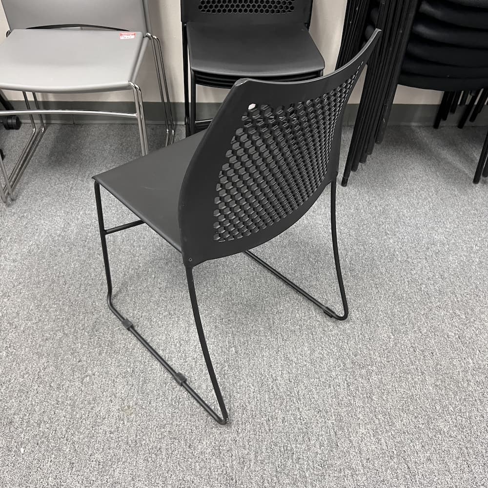black plastic stacking chair, molded, used office furniture, used seating