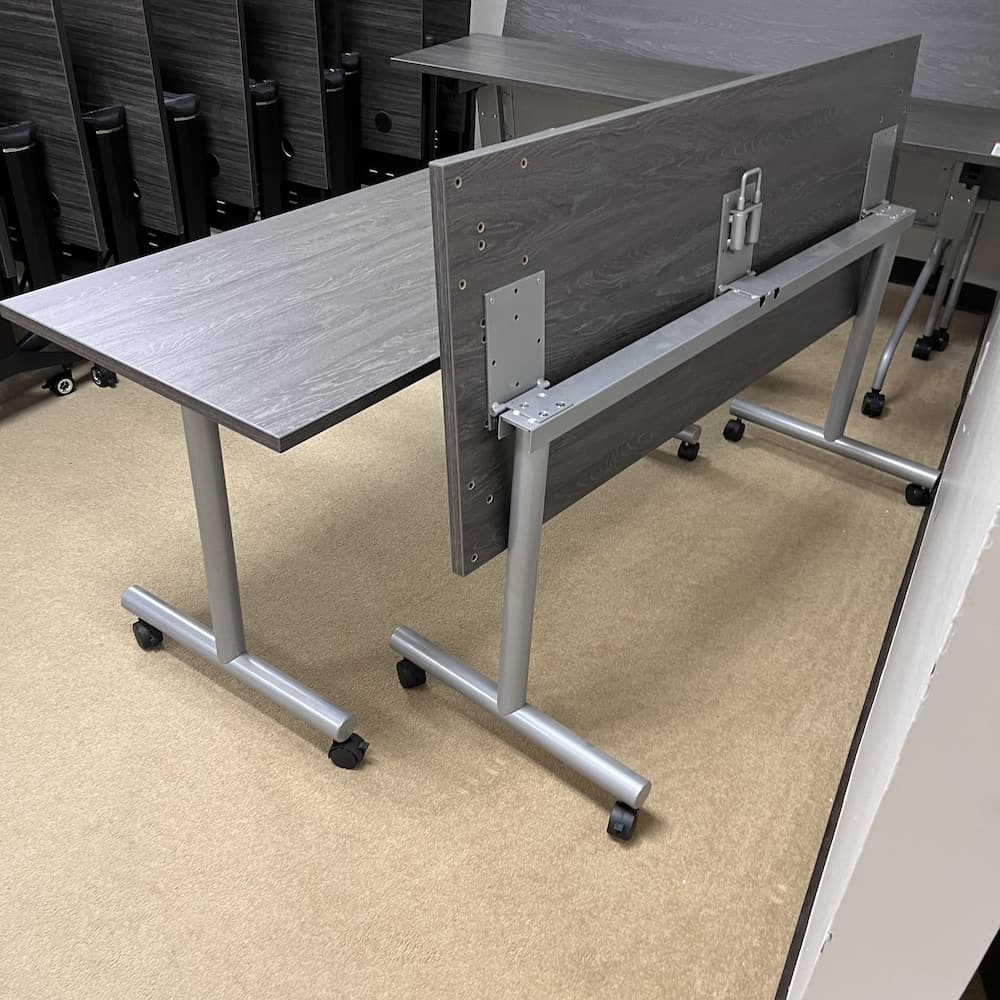 60x24 grey laminate training table with grey base, flip, fold nest, used office furniture desk break room