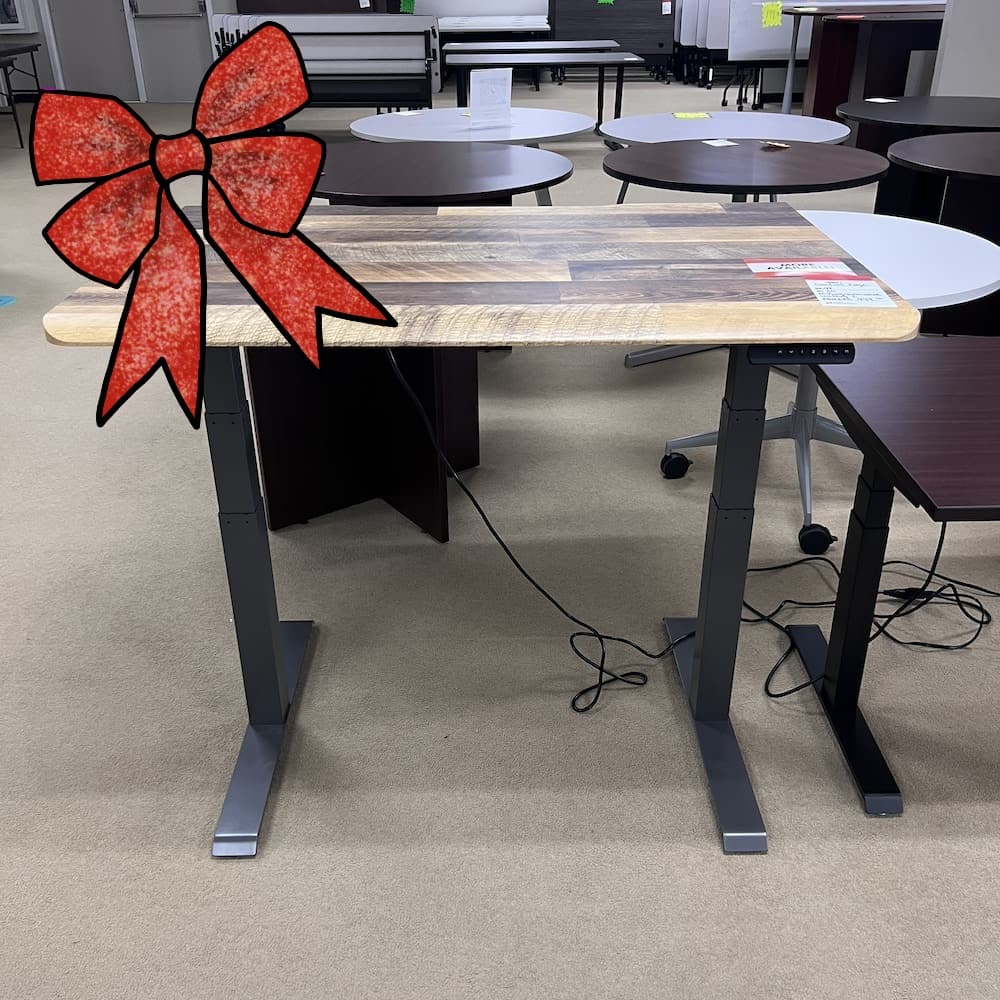ribbon woodgrain laminate vari desk top with a grey metal base, comfort edge, used office furniture