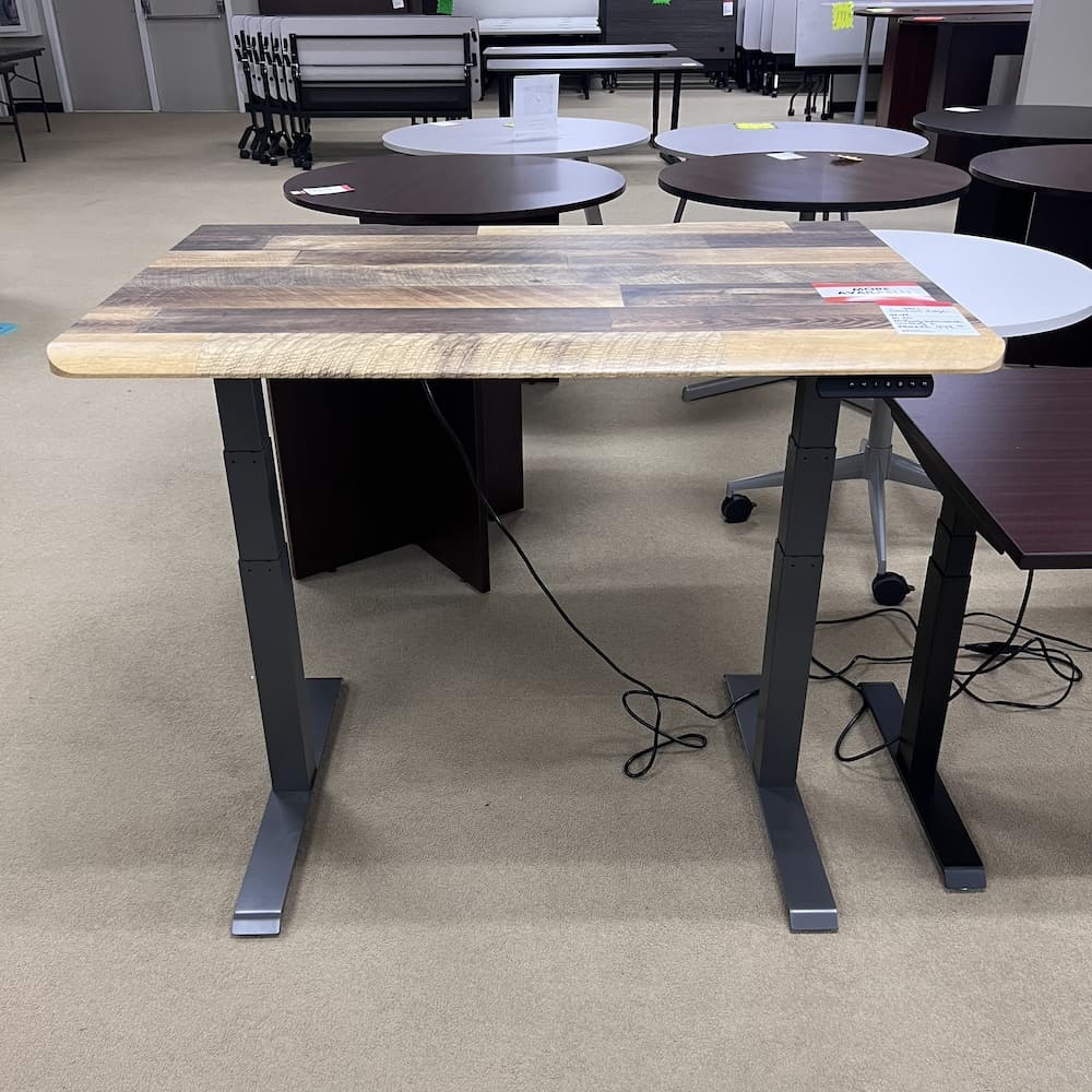woodgrain laminate vari desk top with a grey metal base, comfort edge, used office furniture