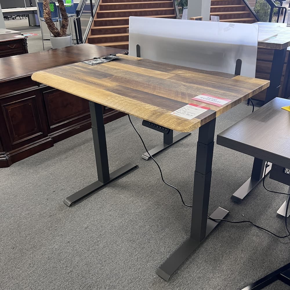 woodgrain laminate vari desk top with a grey metal base, comfort edge, used office furniture