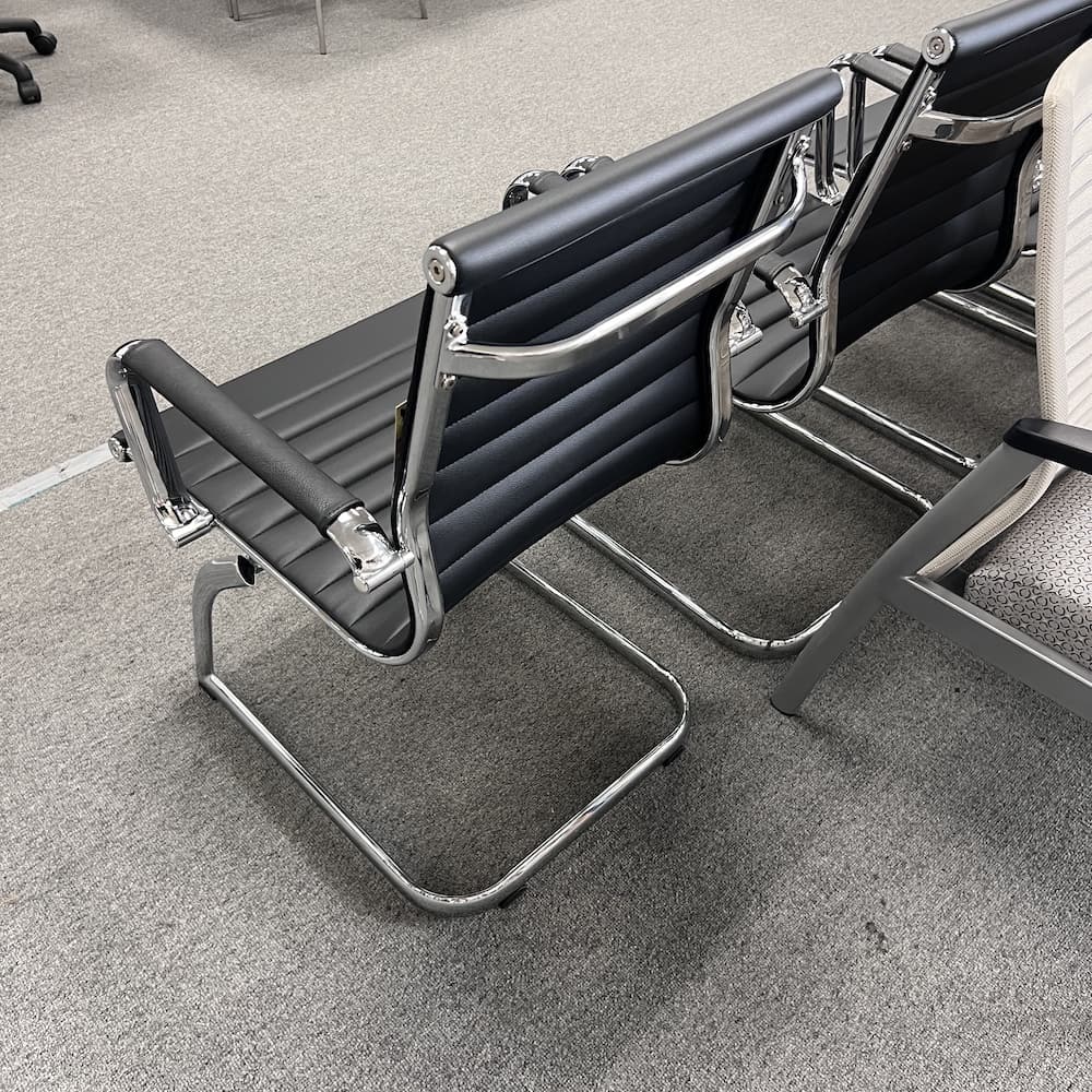 black vinyl and chrome modern guest chair with sled base, used office furniture