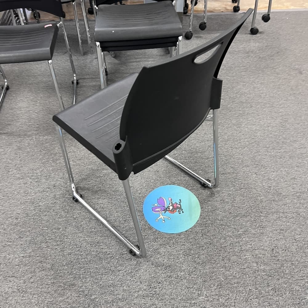 black plastic stacking chair with chrome legs, used office furniture