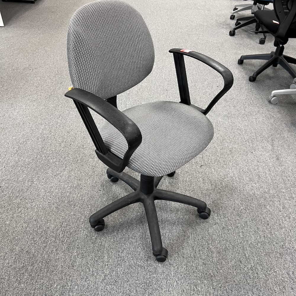 grey upholstered conference chair with black arms and components, used office furniture, seating