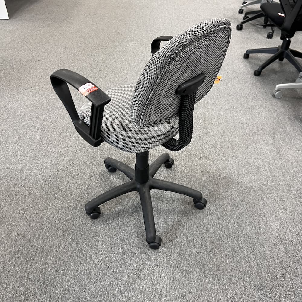grey upholstered conference chair with black arms and components, used office furniture, seating