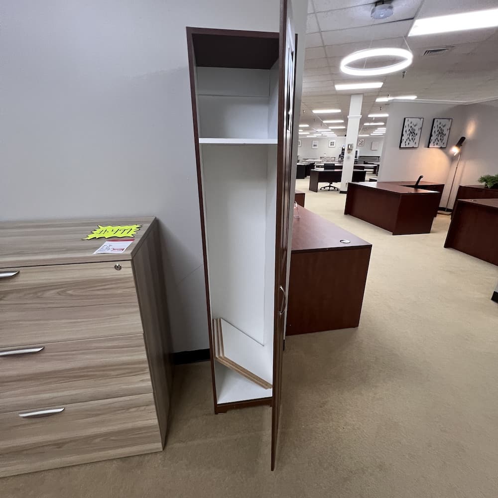 Storage cabinet laminate with single door and shelves inside. Used furniture, office solutions, white laminate interior