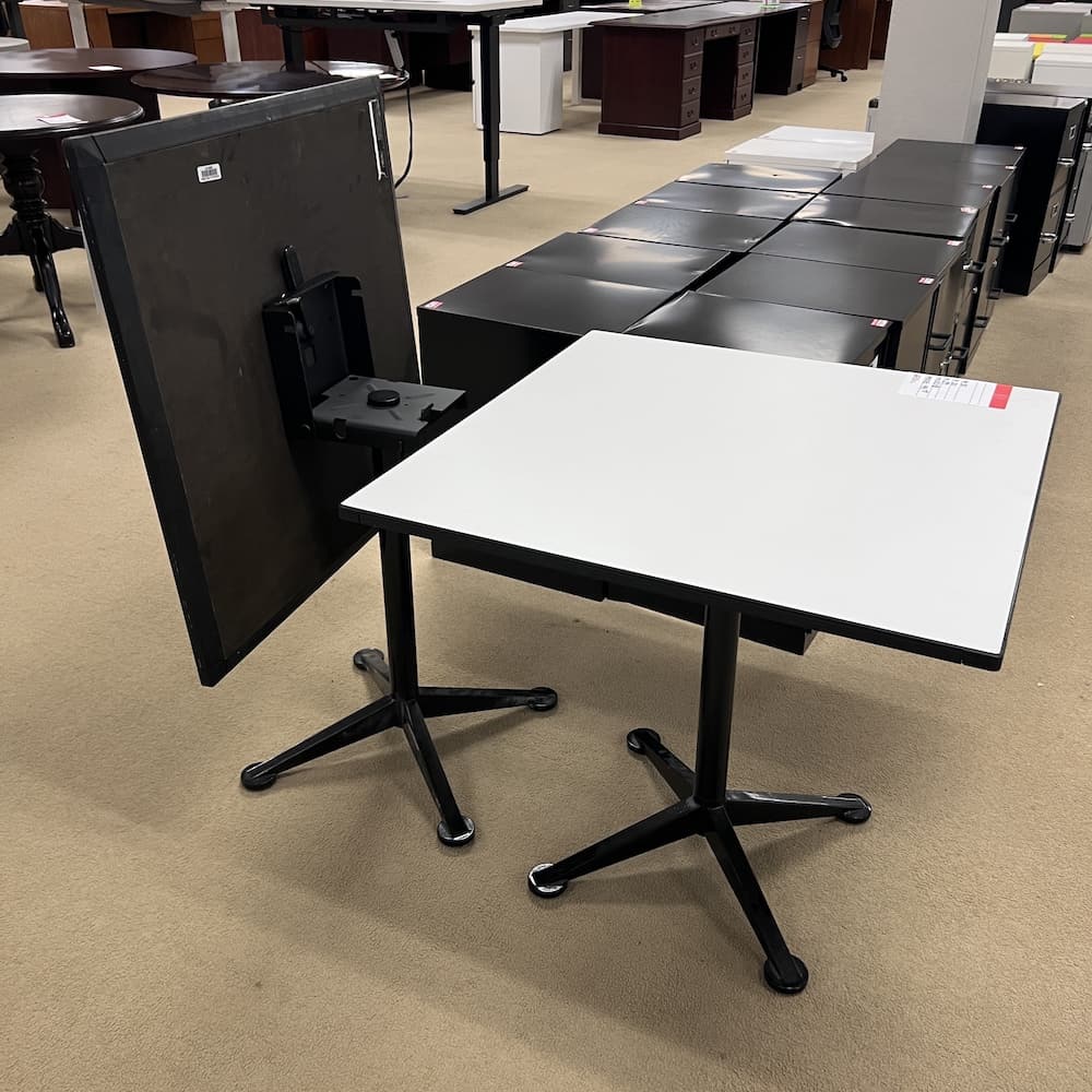 white laminate 30" x 30" flip top cafe table with black base. Used restaurant tables, used office furniture, break room table