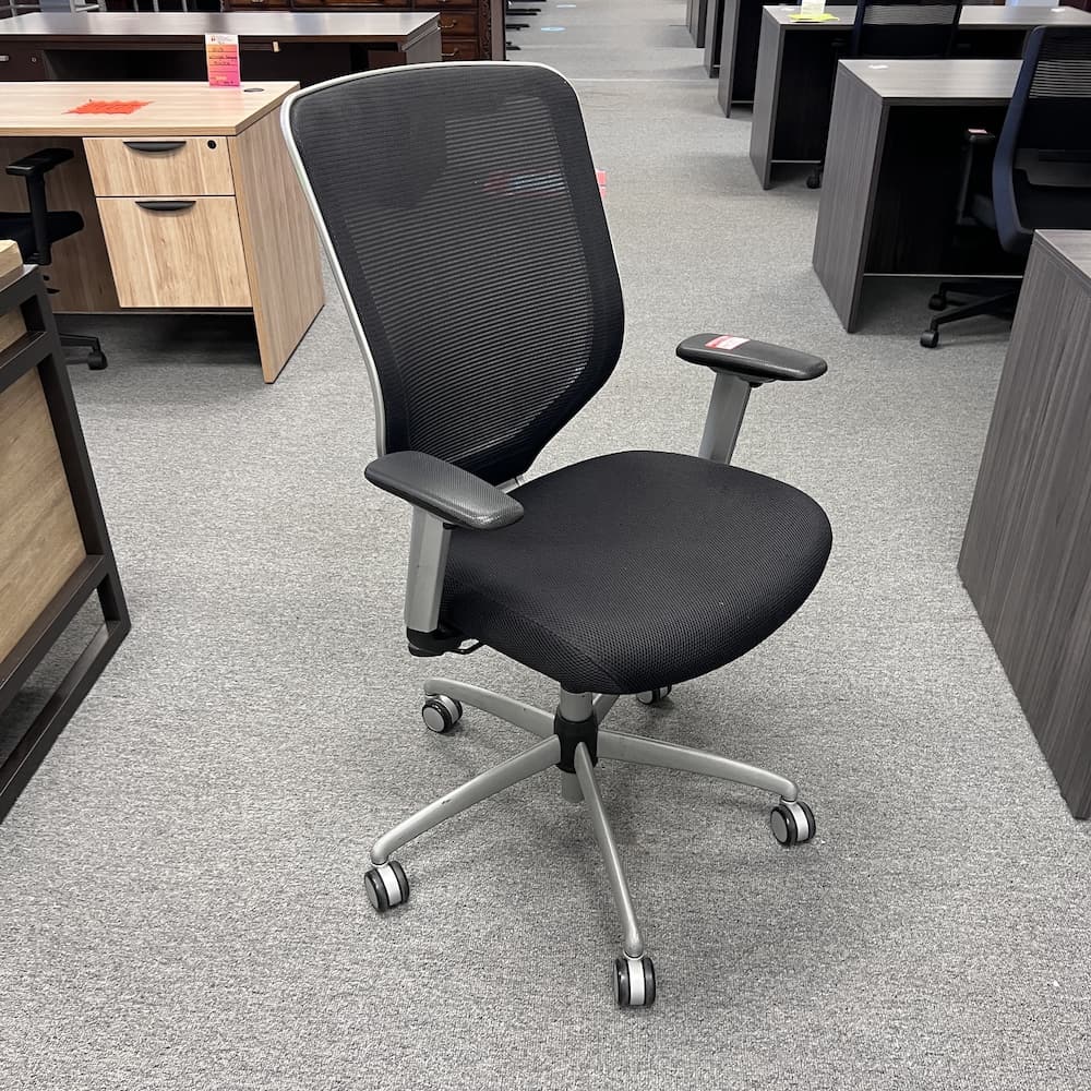 black mesh back task chair with upholstered seat, silver framing and base, used office furniture