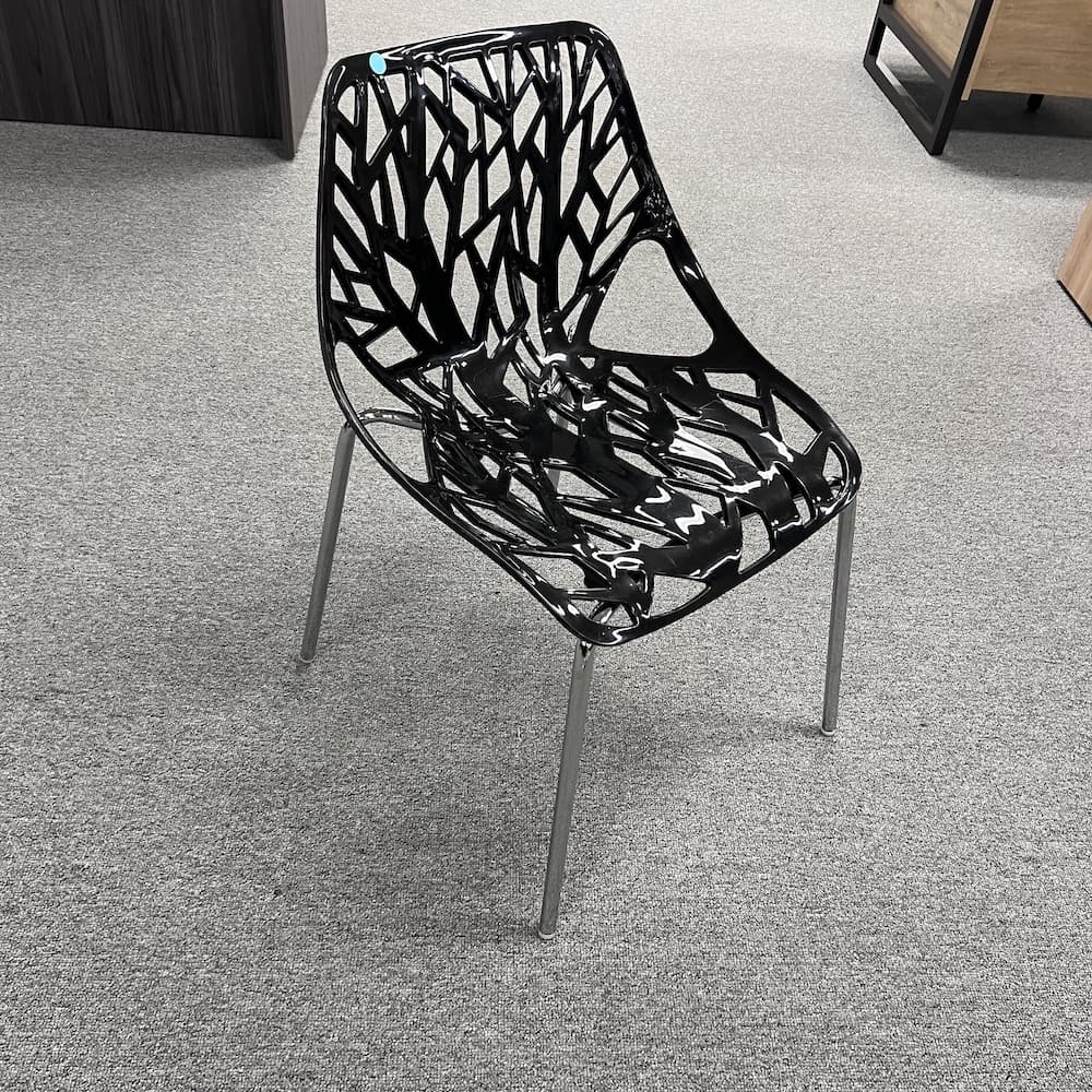 black plastic stacking chair, bird's nest, used furniture