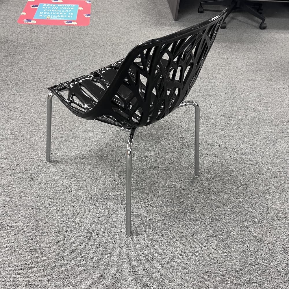 black plastic stacking chair, bird's nest, used furniture