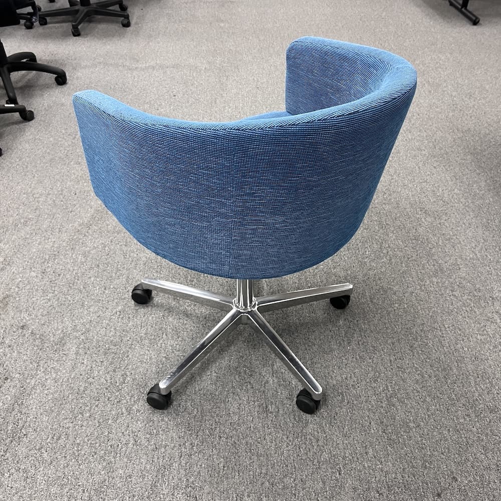 blue upholstered barrel rolling chair on 5 point star, used office furniture